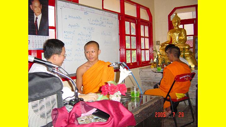015ganchanashinha cheking.jpg - Ganchana Shinha, a teacher of the Transcendental Meditation Programme is seen teaching a young monk to meditate in Thailand, in the Temple of the Sun. This is the first temple in Thailand where Reverend Oshima inspired monks at the age of 16 or 17 years of age to learn